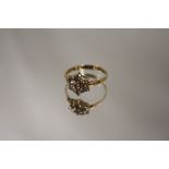 A 9 CARAT GOLD FLORAL SET RING