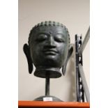 A MODERN METAL BUDDHA HEAD ON STAND