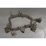 A SILVER CHARM BRACELET APPROX WEIGHT 30.9G