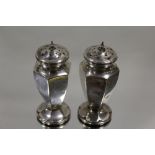 A PAIR OF HALLMARKED SILVER PEPPERETTES