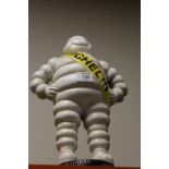 ***A LARGE MODERN CAST METAL MICHELIN MAN STOOD ON A TYRE FIGURE*