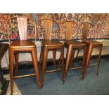 A SET OF FOUR MODERN INDUSTRIAL TALL STOOLS