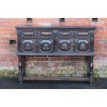 AN ANTIQUE OAK JACOBEAN STYLE TALL DRESSER, with two short drawers and two deeper drawers below,