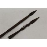 TWO EARLY 20TH CENTURY AFRICAN SUDANESE BARBED IRON FISHING SPEARS, shortest L 32 cm, longest L 48 c