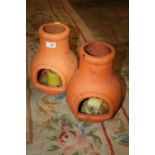 TWO SMALL CHIMINEA STYLE CANDLE HOLDERS