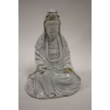A CHINESE BLANC DE CHINE SEATED FIGURE A/F