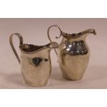 TWO GEORGIAN HALLMARKED SILVER CREAM JUGS, comprising Birmingham 1913 and Birmingham 1929, tallest H