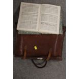 A VINTAGE LEATHER SATCHEL OF SHEET MUSIC