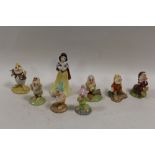 A SET OF ROYAL DOULTON SNOW WHITE AND THE SEVEN DWARF'S FIGURES