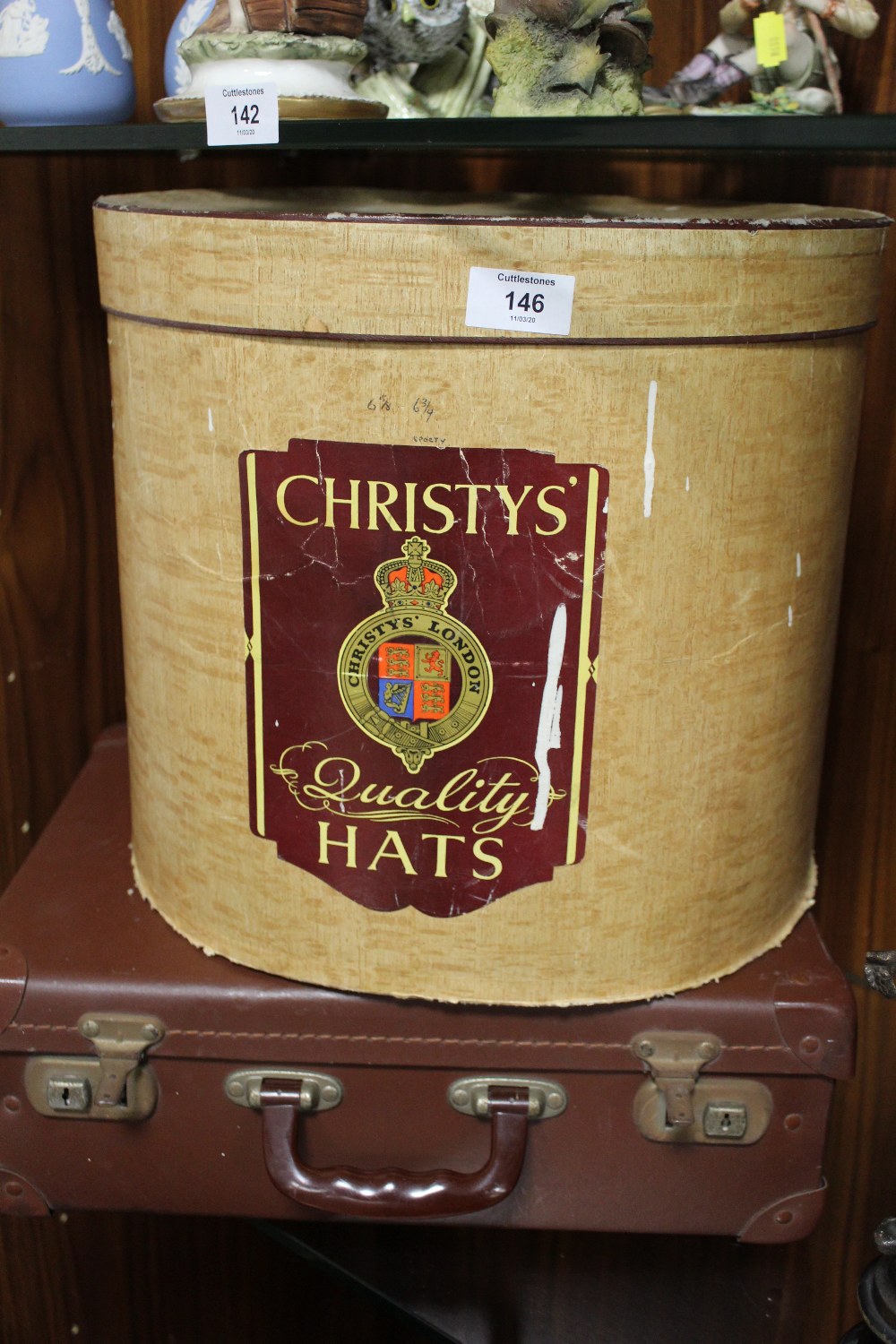 A CHRISTYS HAT BOX CONTAINING A TOP HAT AND BOWLER HAT, TOGETHER WITH A VINTAGE BRIEFCASE