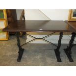 A WOODEN TOPPED CAST BASE PUB TABLE H-72 W-61 L-107 CM ( NOTE ALL PUB TABLES ARE THE SAME