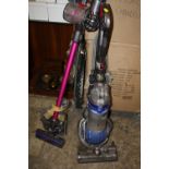 A DYSON DC25 VACUUM TOGETHER WITH A DYSON V6