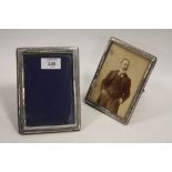 TWO HALLMARKED SILVER PICTURE FRAMES, to include a Chester example, tallest H 16.5 cm (2)