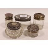 A COLLECTION OF SILVER LIDDED VANITY JARS, various dates and makers, to include a lidded salts jar