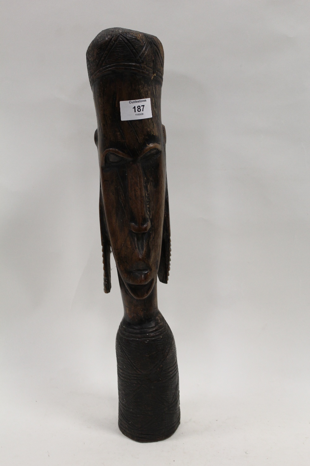 A HARDWOOD TYPE CARVING OF A TRIBAL FIGURE, H 49 cm