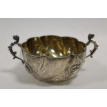 A HALLMARKED SILVER TWIN HANDLED FLUTED BOWL - LONDON 1895, with floral banded decoration, the