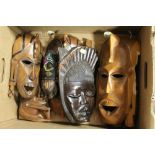 A COLLECTION OF AFRICAN TRIBAL MASKS AND OTHER CARVINGS