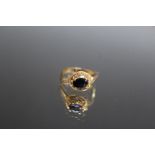 A 14K YELLOW GOLD SAPPHIRE AND DIAMOND RING, set with a claw set oval sapphire of an estimated 0.