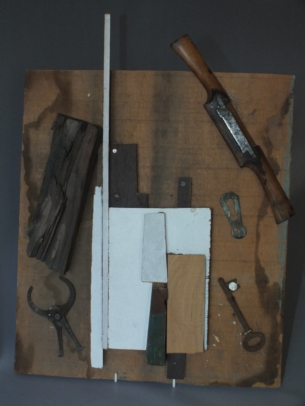 ISLWYN WATKINS (XX). Welsh school, abstract collage of various woods and implements, signed verso,