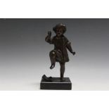 A BRONZE MODEL OF A YOUNG GIRL STAMPING ON A BOOK, H 19.5 cm