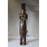 A VINTAGE WOODEN TRIBAL FIGURE, of a pregnant woman with compartment that opens to reveal a baby,