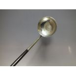 A HALLMARKED SILVER WHALE BONE HANDLED TODDY LADLE WITH INSET COIN TO BOWL - GLASGOW 1825, L 43 cm