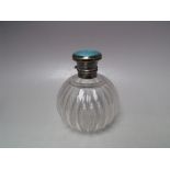 A HALLMARKED SILVER AND GUILLOCHE ENAMEL LIDDED PERFUME BOTTLE, of ribbed globular form, 12.5 cm
