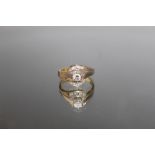 A 585 WHITE GOLD DIAMOND RING, the central brilliant cut diamond being an estimated 0.25 carat, with