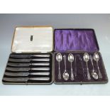 A CASED SET OF SIX HALLMARKED SILVER TEASPOONS WITH A PAIR SUGAR TONGS - CHESTER 1916, together with