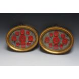 A PAIR OF OVAL GILT FRAMED AND GLAZED WAX SEAL IMPRESSIONS, W 24 cm