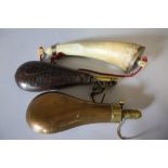 A 19TH CENTURY POWDER HORN, L 26 cm, together with a 19th century leather powder flask, L 22 cm