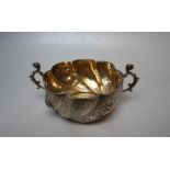 A HALLMARKED SILVER TWIN HANDLED FLUTED BOWL - LONDON 1895, with floral banded decoration, the