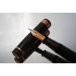 AN ONOTO MAGNA 1876 FOUNTAIN PEN, with 14ct. gold De La Rue Onoto London No.7 nib, stamped to the