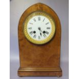 A BURR WALNUT ARCHED MANTLE CLOCK WITH JAPY FRERES MOVEMENT, striking on a bell, stamped to the