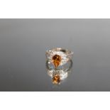 A 14K WHITE GOLD PEAR SHAPED CITRINE AND DIAMOND RING, the Citrine being an estimated 1.5 carat,