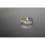 A GRADUATING FIVE STONE DIAMOND RING, the old cut diamonds total an estimated 1 carat, ring size N