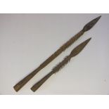 TWO EARLY 20TH CENTURY AFRICAN SUDANESE BARBED IRON FISHING SPEARS, shortest L 32 cm, longest L 48