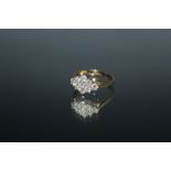 A HALLMARKED 18 CARAT GOLD ONE CARAT DIAMOND CLUSTER RING, set with nine brilliant cut diamonds.