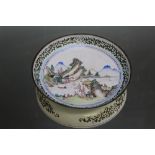 A LOW TIN GLAZE DISH DECORATED WITH A MOUNTAINOUS CHINESE LAKESIDE SCENE, Dia 15 cm