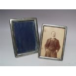 TWO HALLMARKED SILVER PICTURE FRAMES, to include a Chester example, tallest H 16.5 cm (2)