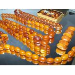 A COLLECTION OF VINTAGE AMBER BEADS, to include a single strand butterscotch bead necklace,