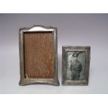 TWO GEORGE V HALLMARKED SILVER PICTURE FRAMES, with decorative embellishment to the edges, tallest H