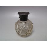 A HALLMARKED SILVER AND TORTOISESHELL LIDDED PERFUME BOTTLE - LONDON 1920, of globular form with