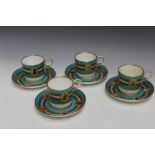 A SET OF FOUR JEWELLED CUPS AND SAUCERS, with indistinct mark to the saucers that appears to be