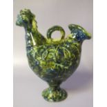 A VINTAGE CONTINENTAL SLIPWARE POT IN THE FORM OF A COCKEREL, indistinct marks to base, H 19 cm, S/