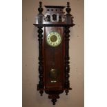 A LARGE MAHOGANY VIENNA WALLCLOCK, of grand proportions, two train movement, striking on a gong,