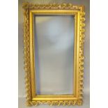 A 19TH CENTURY DECORATIVE GILT FRAME, frame W 9 cm, rebate size 84 x 41 cm