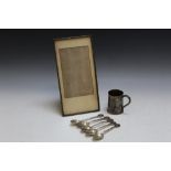AN ORIENTAL RECTANGULAR PICTURE FRAME, together with five silver spoons and a white metal cup with