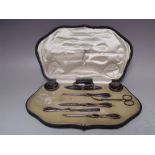 A CASED MAPPIN & WEBB HALLMARKED SILVER AND TORTOISESHELL MANICURE SET - BIRMINGHAM 1915, with pique