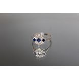 AN 18CT WHITE GOLD DECO STYLE SAPPHIRE AND DIAMOND RING, three sapphire being an estimated 0.33